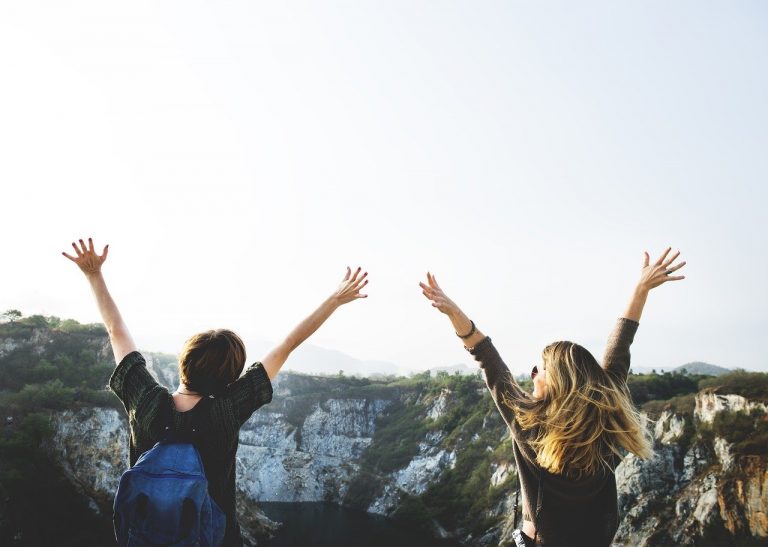 a group of people raising their hands